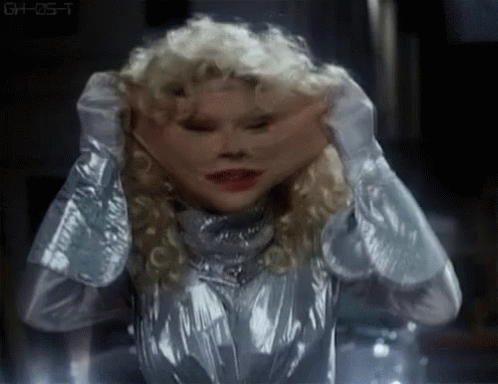 Silver Suit Woman Covering Face Making Funny Expression