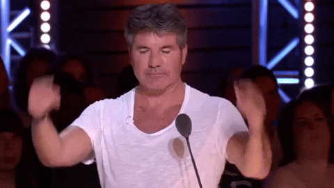 Simon Cowell Ear Plugs With His Fingers GIF