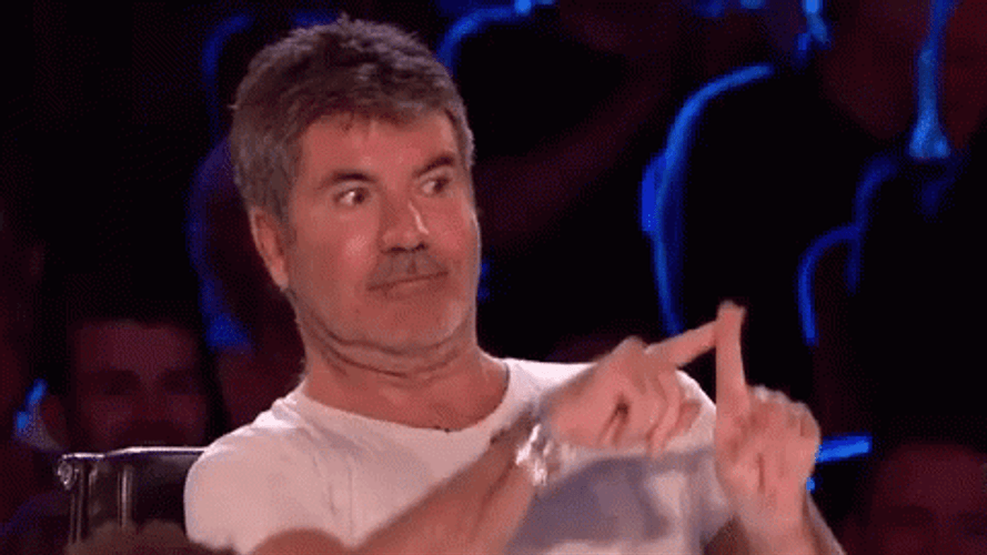 Simon Cowell Putting Up Cross GIF