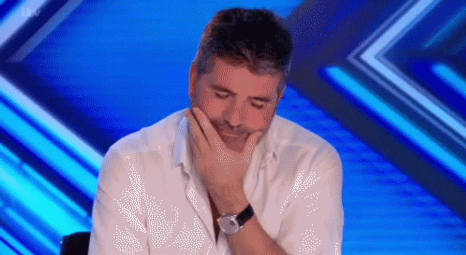 Simon Cowell Trying Not To Laugh GIF