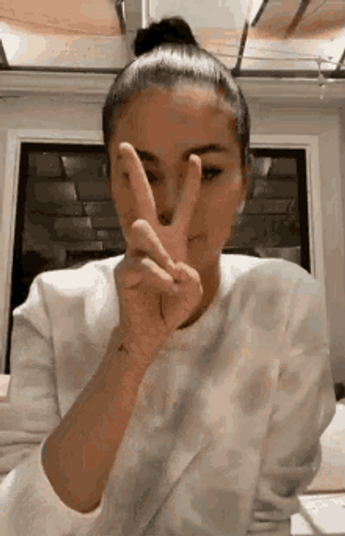 Singer Selena Gomez 2 Finger Sign GIF