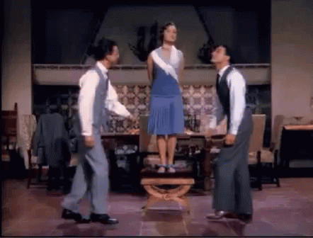 Singin' in the Rain Three People Holding Umbrellas