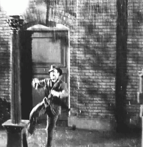 Gene Kelly Dancing Singing In The Rain GIF