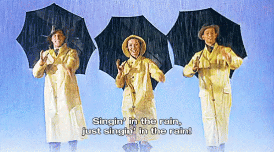 Singing In The Rain In Raincoats GIF