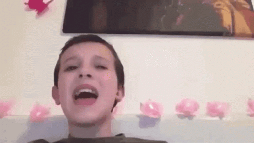 Singing Millie Bobby Brown Flower Background GIF
