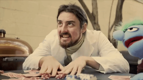 Sinister Smile Laying Poker Cards GIF