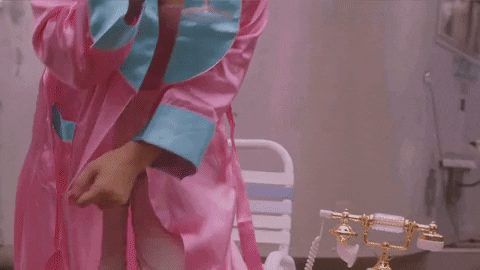 Sit Down Woman Holding Wine Glass GIF