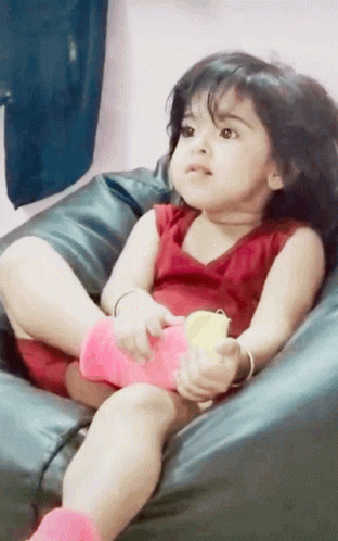 Siting Baby Girl Showing Number Four GIF