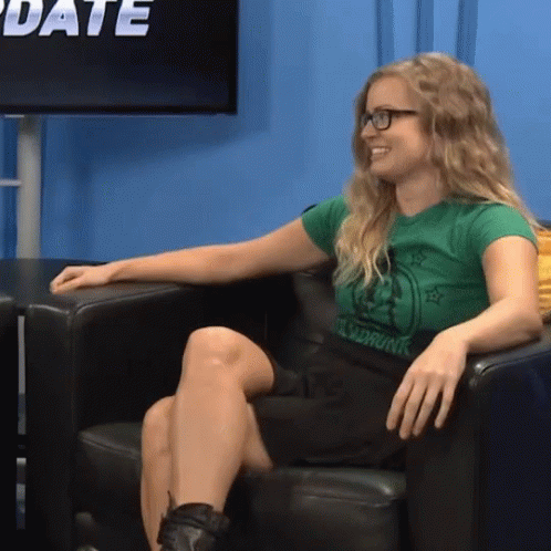 Sitting Girl Playing Smallest Violin GIF