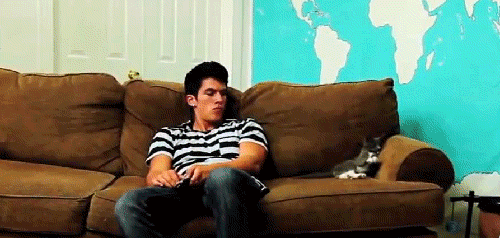 Sitting Guy Raise Hand GIF