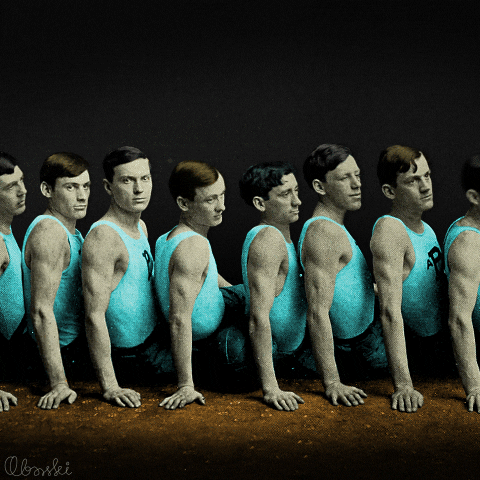 Sitting Men Bumping Heads Domino Chain Reaction GIF