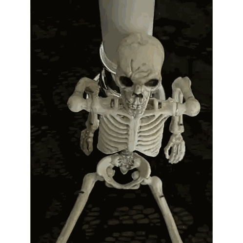 Skeleton Holding Candle