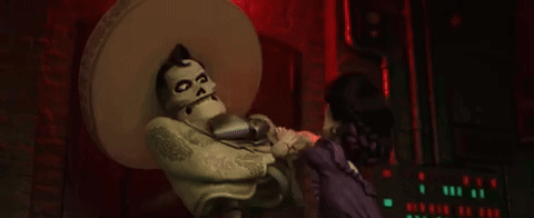 Skeleton In Sombrero Dancing With Woman In Purple GIF