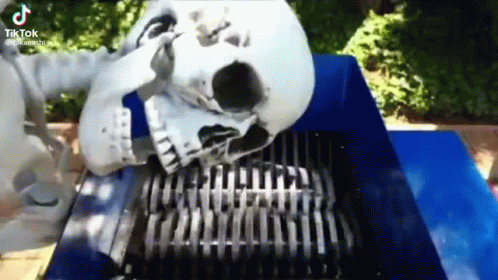 Skeleton Laying on Shredder With Skull in Mouth