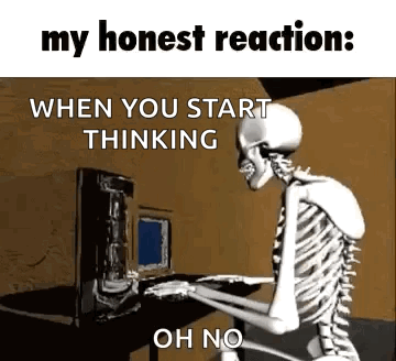 Skeleton Sitting at Desk With Computer Keyboard