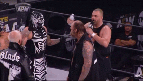Skeleton Wrestler Talking to Another Wrestler