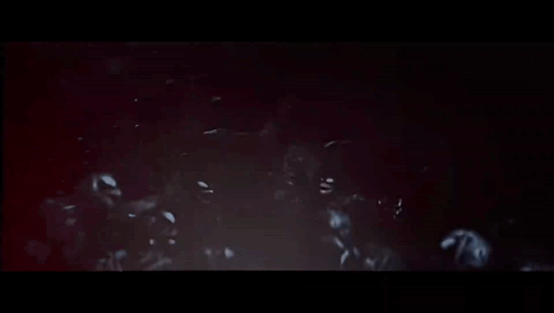 Skeletons In Dark Room With Arms Outstretched GIF