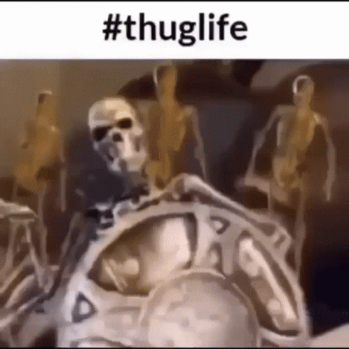 Skeletons Standing Around Man Statue GIF