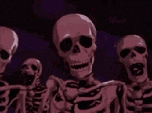 Skeletons Standing in Dark Room Smiling