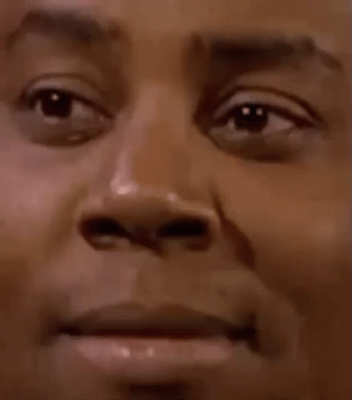 Skeptical Kenan Thompson Squinch Close Up GIF