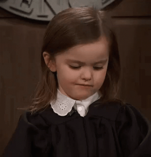 Skeptical Little Girl Smirking GIF