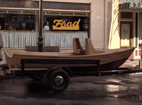 Skiff Parked On Street People Passes By GIF