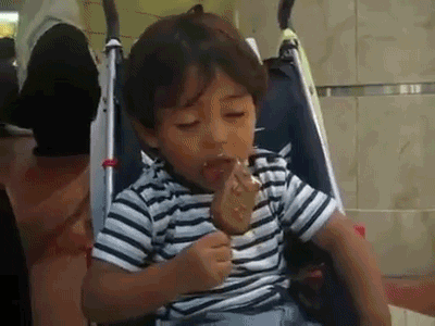 Sleepy Boy Funny Eating GIF
