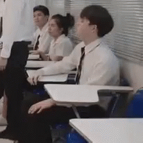 Sleepy Student Almost Banging Head On Desk GIF
