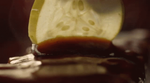 Slice Of Apple With Brown Sauce GIF