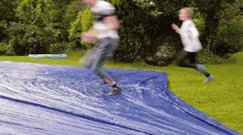 Slipping On A Big Blue Slide GIF
