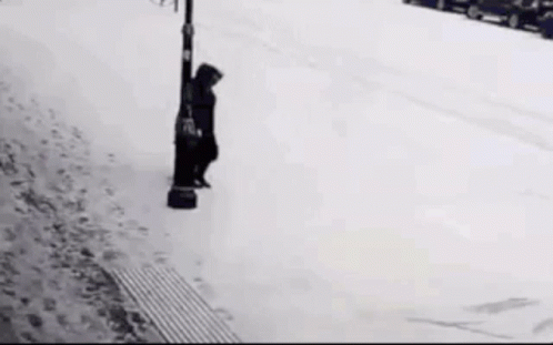 Person Hilariously Slipping On Ice While Walking GIF