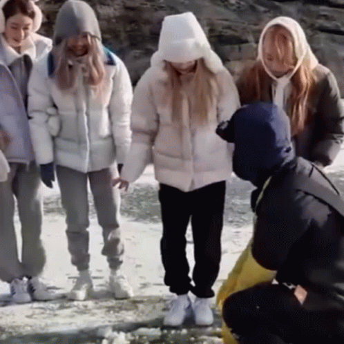 Group Of Friends Slipping On Ice GIF