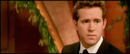 Sly Smile Ryan Reynolds GIF