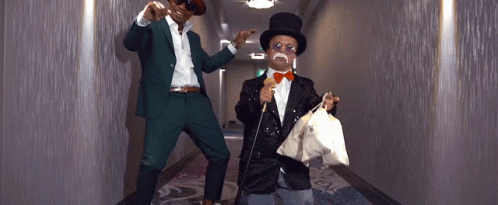 Small Mr Monopoly Holding Bags Of Money GIF