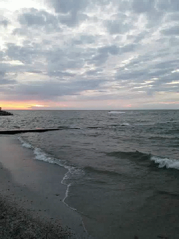 Small Ocean Waves Approaching Coastline GIF