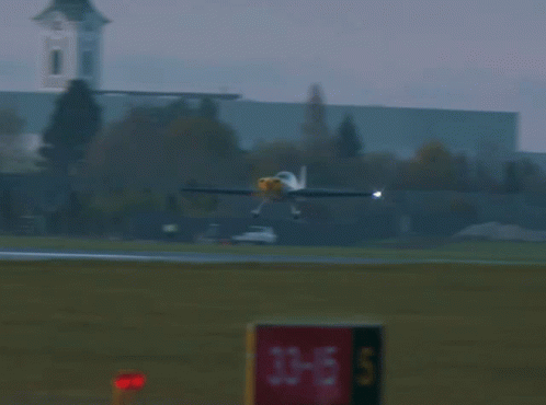Small Plane Taking Off with 33-15 s Sign