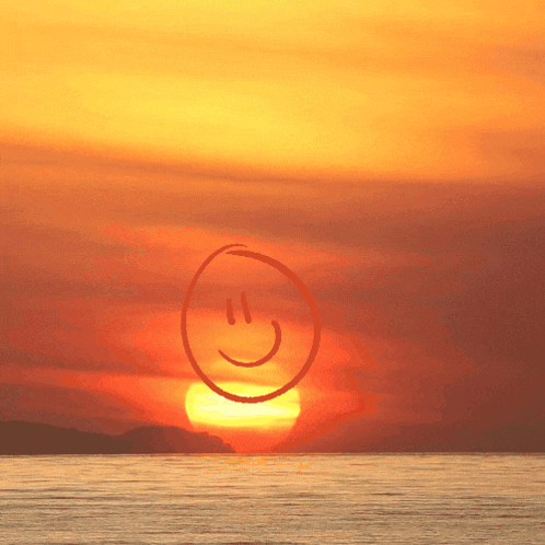 Smiley Face In Front Of Sunset GIF