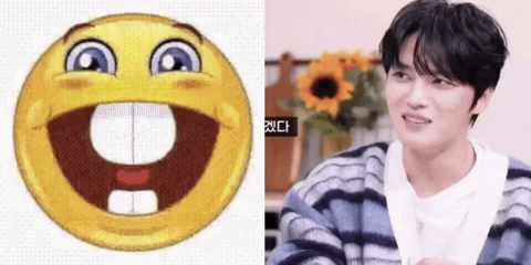 Smiley Face Next to Man in Striped Sweater