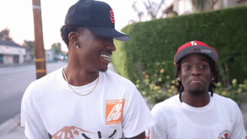 Smiling Duke Dennis Walking With Someone GIF