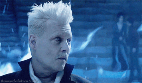 Smiling Gellert Grindelwald On Blue Fire GIF