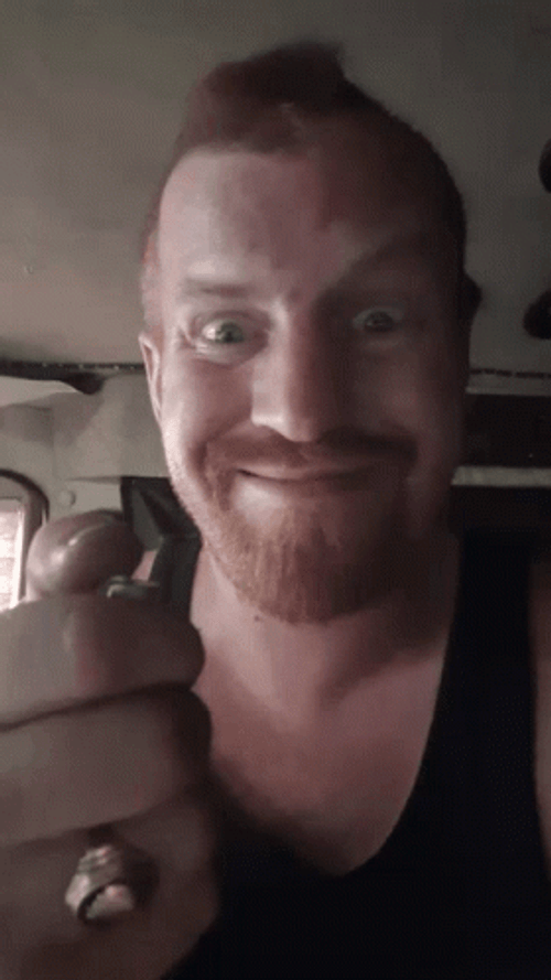 Smiling Guy Lighting Lighter GIF