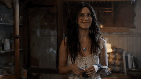 Smiling Happy Woman Shrugs GIF