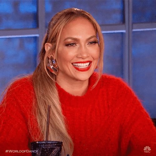 Smiling Jlo In Red Sweater GIF