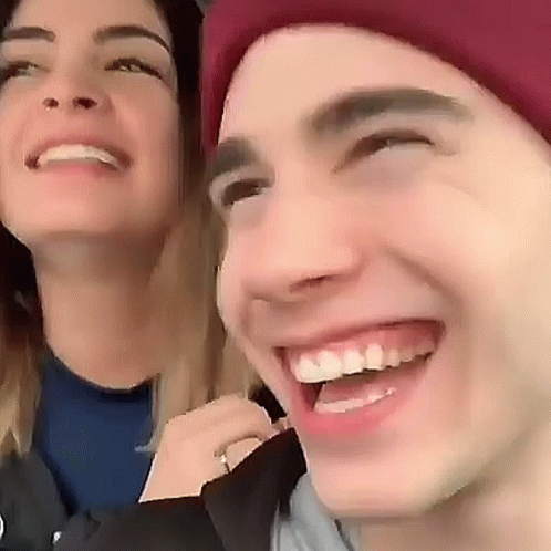 Smiling Man and Woman with Red Hat