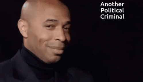 Smiling Man Black Turtleneck Saying Another Political Criminal