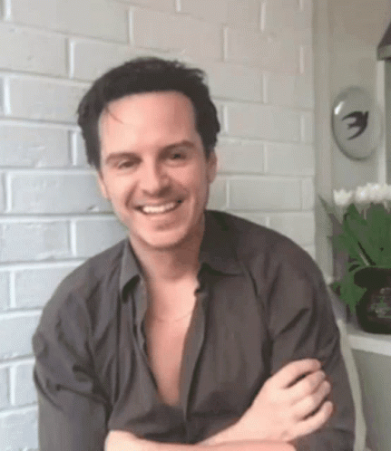 Smiling Man Crossed Arms Brick Wall