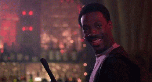 Smiling Man Holding Sword in Bar
