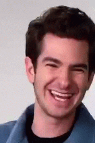 Smiling Man in Blue Shirt