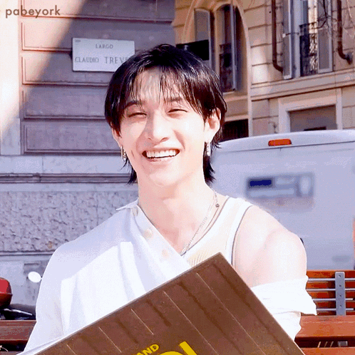 Smiling Man In Front Of Largo Claudio Trevi Sign GIF