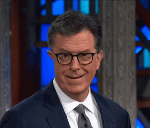 Smiling Man in Glasses and Suit